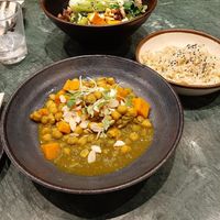 Main dishes of the lunch deal. Green curry with chickpeas and pumpkin. Served with rice. The other dish is a Buddha bowl. The curry was decent, but misses the kick of a real curry. at The Green Affair - Chiado in Lisbon