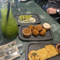 starters and green sangria - gyozas, fried cauliflower (OMG the cheese dip!!!), and breads  at The Green Affair - Chiado in Lisbon