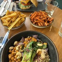 Buddha bowl and cascáis burger. The sweet potato fries are a must!!  at The Green Affair - Chiado in Lisbon