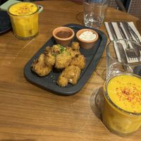 Cauliflower wings & mango and turmeric mocktail!  at The Green Affair - Chiado in Lisbon