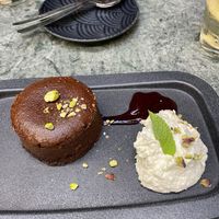 chocolate cake with whipped cream (coconut) and some berry glaze  at The Green Affair - Chiado in Lisbon