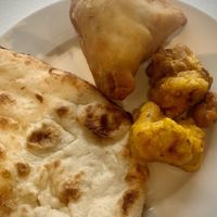 Vegan Naan! Samosa and cauliflower bite. Very tasty ! at NOSH India Bistro in Edmonton