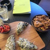 Avocado toast and smoothie bowl with peanut butter on top at Roots in Zagreb