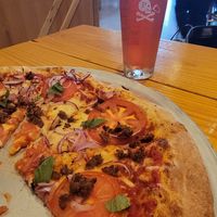 Margarita pizza made vegan with vegan cheese and beyond sausage (added onions) at Pinthouse Pizza in Round Rock