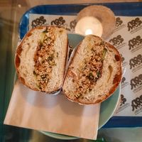 Hoisin tofu sandwich (shredded tofu, sliced cucumber, fried leeks, crispy onions in a soft white roll) at Siop Shop in Manchester