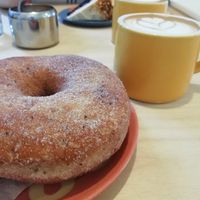 Cinnamon sugar doughnut, pea milk flat white at Siop Shop in Manchester