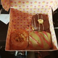 Crunchy coconut almond, chocolate with cream and apple donut at Brammibal's Donuts - KaDeWe in Berlin