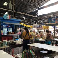 Look for the yellow flags with the red "17" symbol on them. at Chalawan - Vegan Food Stall in Bangkok