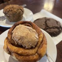 Cinnamon roll (very sweet, but delicious), with blueberry muffin and chocolate cookie in the background  at Protagonist Cafe in St Louis