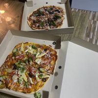 Super delicious vegan pizza with plenty of veggies for take away ! at Horizon Cafe in Koh Samui