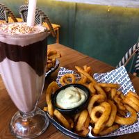 Choc Peanut Butter Vegan Shake ❤️ & Curly Fries with vegan aioli  at Burger Burger in Christchurch