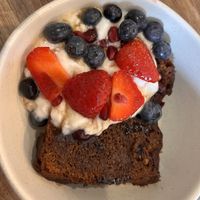 Banana choc chip loaf toasted with coconut yoghurt with maple syrup and berries - unreal!   at Mr Cooper's Coffee House in Whitby