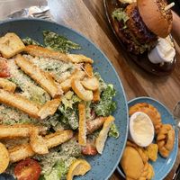 Chicken Caesar, with empanada and popcorn chicken appetizers   at Palo Verde in Prague