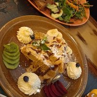 Omelet with kimchi and waffles with peanut sauce, chocolate sauce and whipped cream 🤤 at Palo Verde in Prague