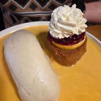 Vegan steak, served with a Czech dumpling and a vegetable gravy, as well as jam, a slice of lemon and whipped cream. at Palo Verde in Prague