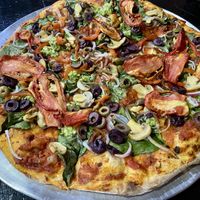 Vegan pizza with lots of toppings  at Minuteman Pizza in Uyuni