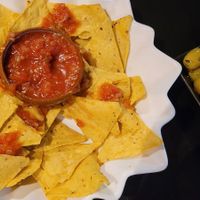 Nachos with salsa and marinated olives at Minuteman Pizza in Uyuni