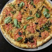 Large Pizza 🍕 (45cm for 80BOB) toppings are 10 BOB each. Vegan cheese as well. This one was 120BOB (vCheese, Tomato, Olives, Basil) at Minuteman Pizza in Uyuni