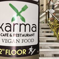 Sign out front showing direction  at Karma in Jaco