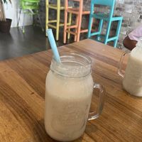 Batido energy (mani, banano, dátiles y leche de almendras)  at Karma in Jaco