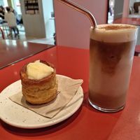 Iced coffee with hazelnut butter, and cinnamon roll at Buddy Buddy in Brussels