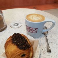 Cappuccino with pain au chocolat at Buddy Buddy in Brussels