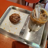 Decaf iced peanut butter coffee and coconut carrot cake at Buddy Buddy in Brussels