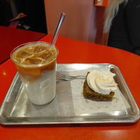 Iced latté and peanut butter matcha cake at Buddy Buddy in Brussels