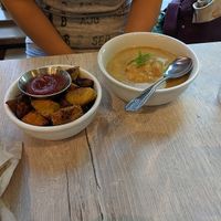 Biscuit and gravy side, and a side of potatoes. at Back To Eden Bakery in Portland