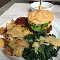 Breakfast sandwich with gravy on the sides at Back To Eden Bakery in Portland