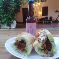 Baguette filled with chorizo (soy), caramelized onion, zuchinni, vegan alioli. at La Barra Cocina y Comunidad in Guadalajara