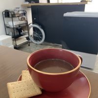 Vegan hot cocoa served with cookies at AcheMi in Seoul