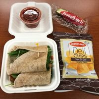 Spinach Veggie Wrap (no cheese). It came with a side, salsa, and a pickle.  at Jason's Deli in Jackson