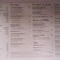 Wall menu (the vegan items are designated with a "V") at Le Pain Quotidien - Bryant Park Kiosk in New York City