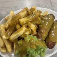 Vegan battered sausages, vegan chips, vegan mushy peas and vegan curry sauce    at Captain Cod in Boston