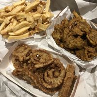 This was the vegan fish, onion rings and chips for one! Threw more than half of it away as it was meh and just very heavy food without much taste. Disappointing.   at Captain Cod in Boston