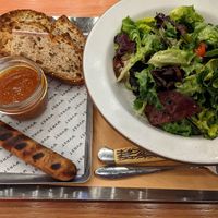 Apple sage currywurst with side salad at WVRST - Union Station in Toronto
