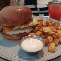 Breakfast sandwich with potatoes, fresh juice of the day (watermelon + pineapple) at Archway Verdun in Montreal