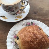 Oat milk cappuccino and vegan chocolatine at Epicerie Muscade in Montreal