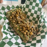 Avocado toast con garbanzos  at Changomango in Merida