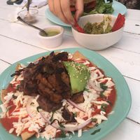 Chilaquiles, avocado and takis  at Changomango in Merida