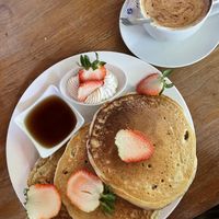 Vegan pancakes with vegan whipped creme. ‘Aztec latte’ with coconut milk.  at De Gustibus Bakery in Puerto Viejo De Talamanca