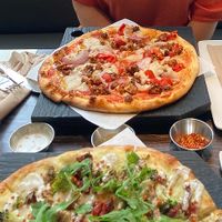 Sweet pepper & sausage pizza and pesto CBR pizza at Virtuous Pie in Victoria