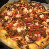 SWEET PEPPER + SAUSAGE
San Marzano Tomato Sauce, Cashew Mozzarella, House-made Italian Sausage, Red Peppers + Onions, Hot Honey at Virtuous Pie in Victoria