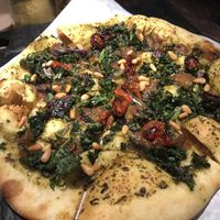 ULTRAVIOLET
Walnut + Arugula Pesto, Cashew Mozzarella, Oven Dried Tomatoes, Kale, Caramelized Onion, Pine Nuts
 at Virtuous Pie in Victoria