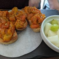 Tomate malandro + bowl of fruit at Brasil Vegano Cafe in Guildford