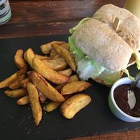 Black bean burger and wedges! Plus a yummy sweet and sour juice   at Brasil Vegano Cafe in Guildford