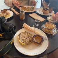 selection of mushroom tarts, pastel de natas and coffees!  at Odete Bakery in Porto
