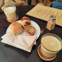 Pastel de Nata, cinnamon bun, pain au chocolat, latté at Odete Bakery in Porto