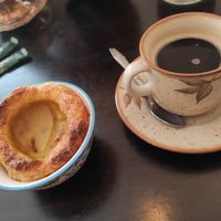 Nata and coffee at Odete Bakery in Porto